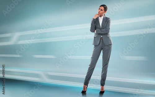 Business woman full length portrait on technological background