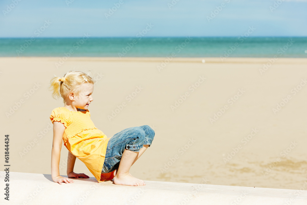 little girl on the beach at sea Stock Photo | Adobe Stock