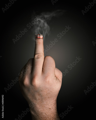 stop smoking concept. cigarette like a middle finger