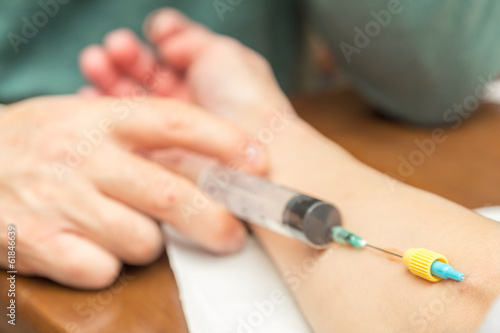 Doctor   Nurse  injects medicine intravenously