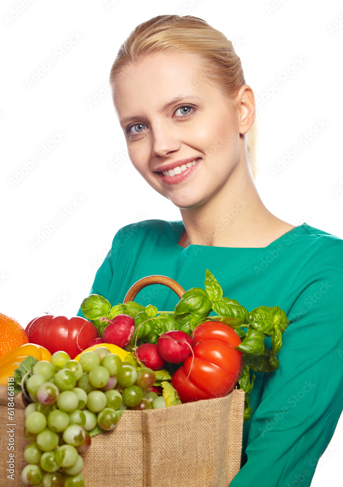 Young woman with a grocery shopping bag. Isolated on white backg Young woman with a grocery shopping bag. Isolated on white backg