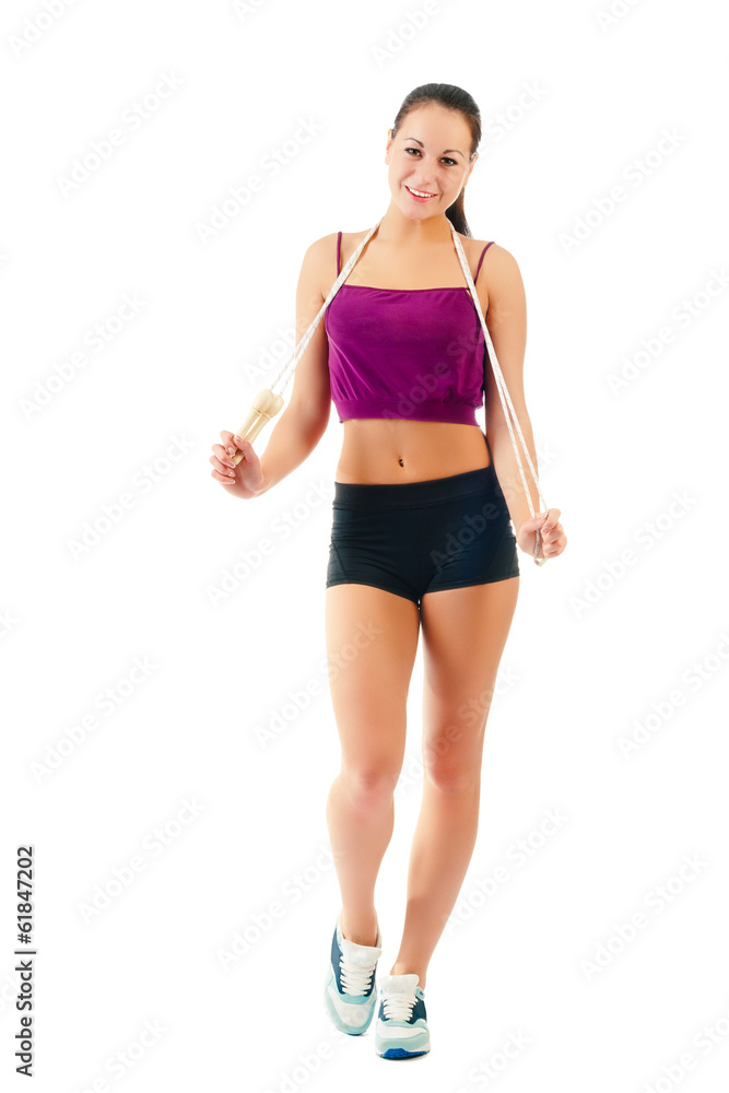 young woman with jump rope on shoulder in sportswear young woman with jump rope on shoulder in sportswear