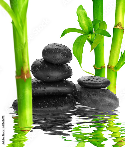 spa Background -  black stones and bamboo on water