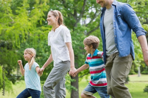 Parents and kids walking in park