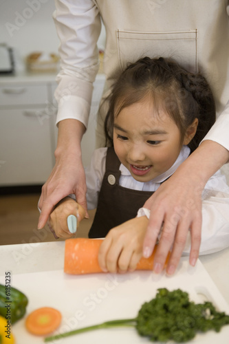 girl cutting carrots