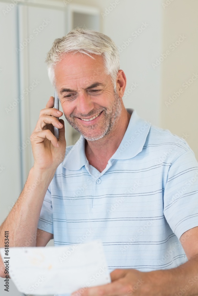Smiling man on a phone call Smiling man on a phone call