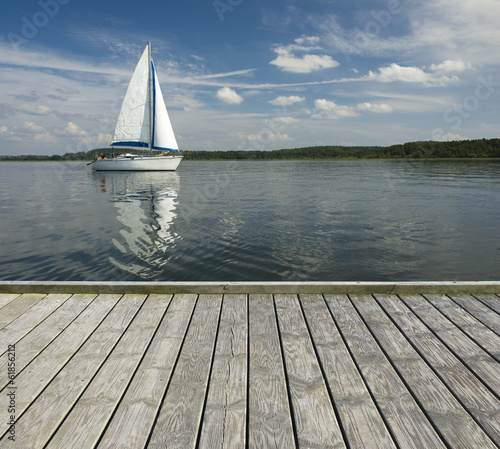 Empty jetty and yacht