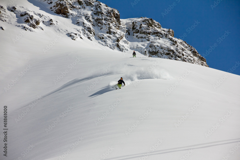 Skier in deep powder, extreme freeride