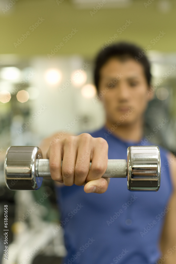 Japanese man with dumbbell Japanese man with dumbbell