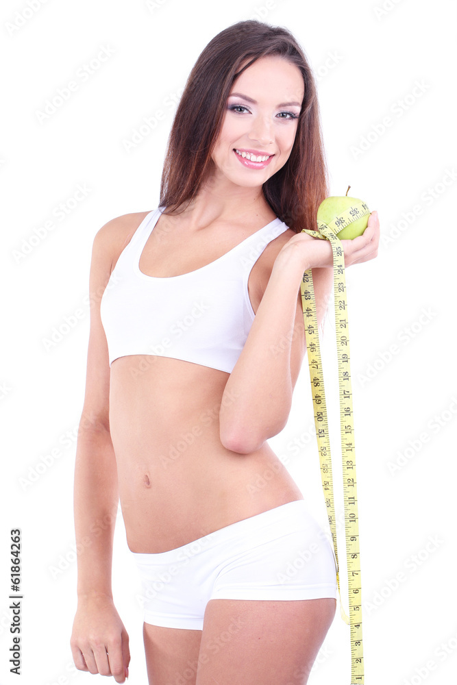 Beautiful young woman with green apple and measuring tape Beautiful young woman with green apple and measuring tape