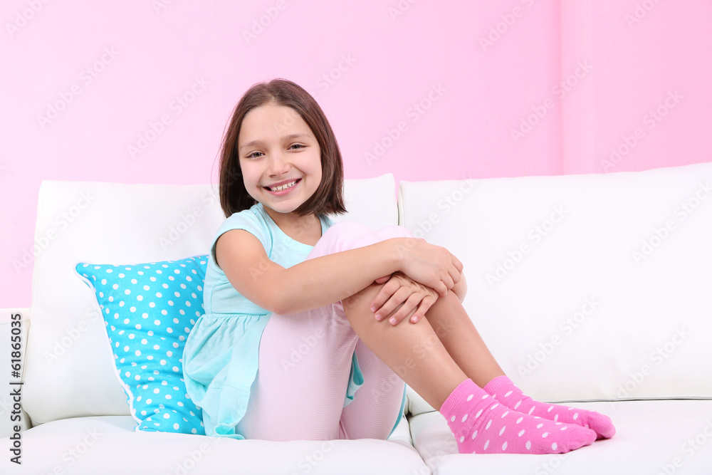 Beautiful little girl sitting