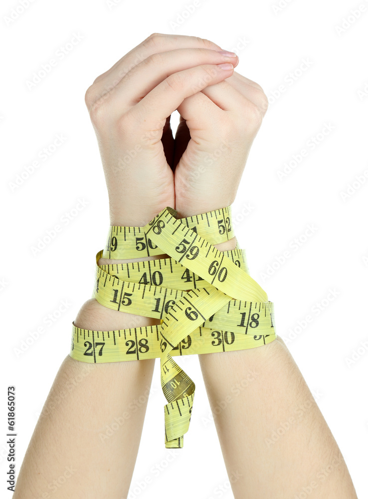 Fototapeta premium Woman hands with measuring tape isolated on white