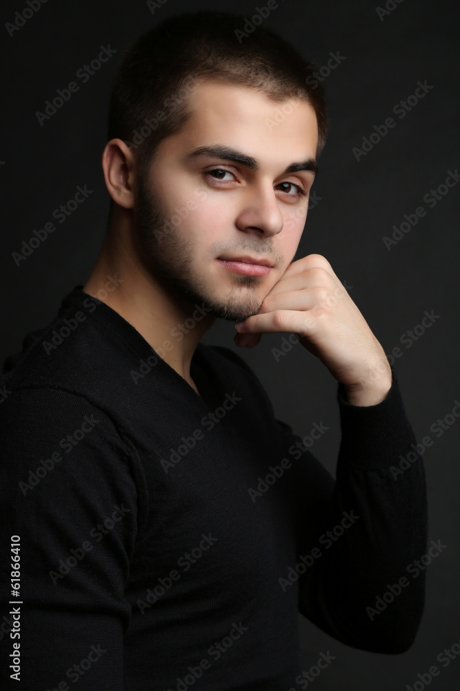 Handsome young man on dark background Handsome young man on dark background