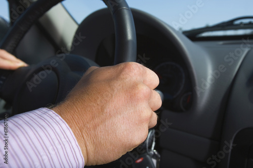 hand of businessman driving