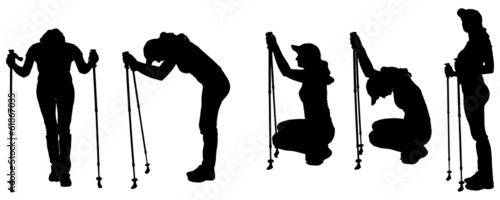 Vector silhouettes of people with trekking stick.