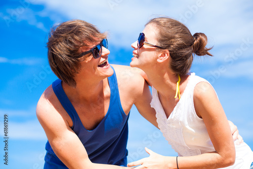 Closeup of happy young couple in sunglasses having fun on © el.rudakova