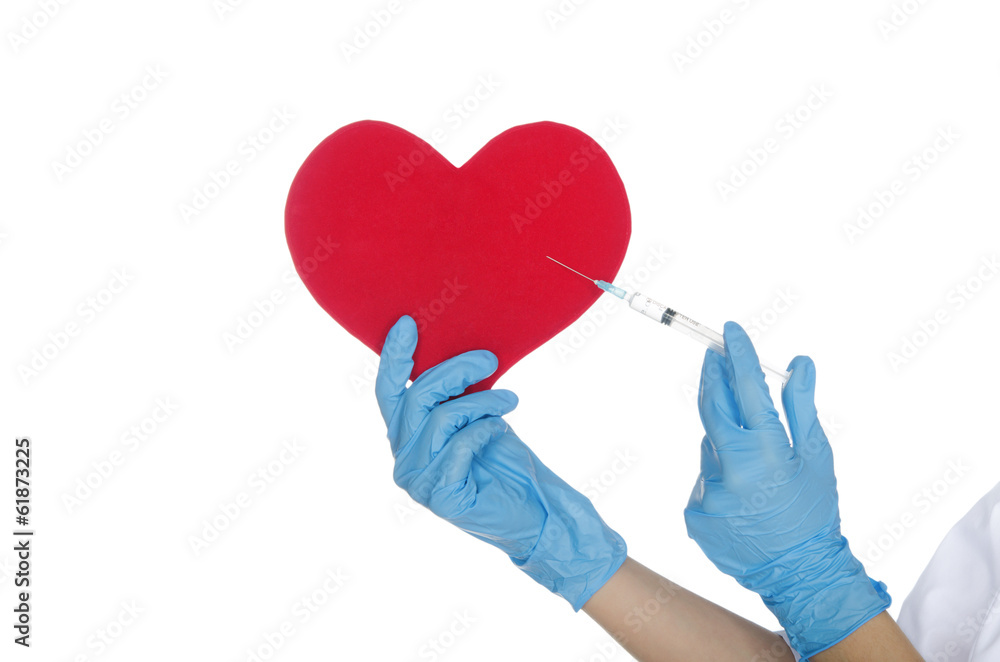 Hand with medical glove makes shot in the heart Hand with medical glove makes shot in the heart