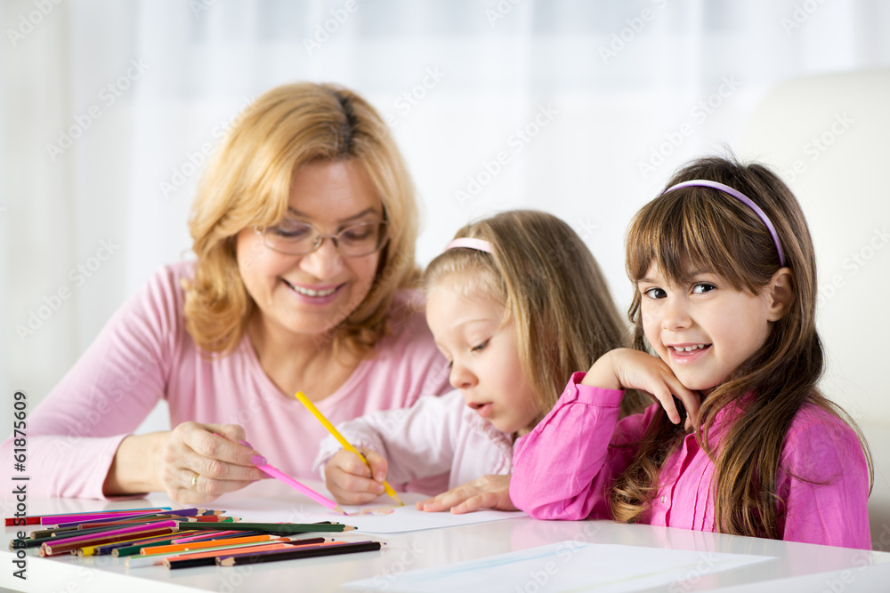 Two little girls drawing with colored pencils Two little girls drawing with colored pencils