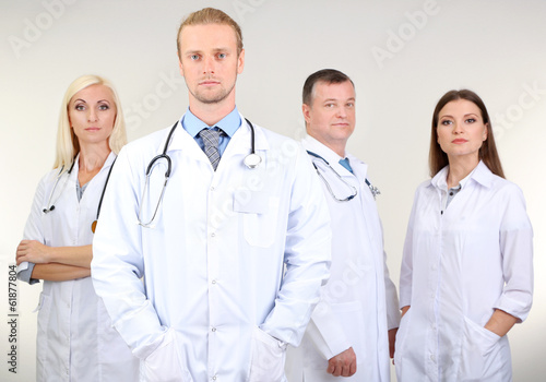 Medical workers on grey bac...