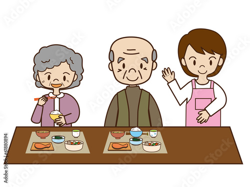 介護士と高齢者の食事 © naoe27