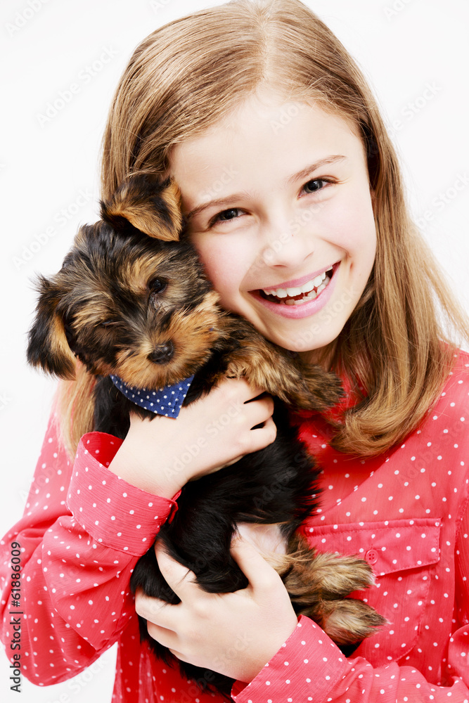 Young girl with puppy, cute Yorkshire terrier Young girl with puppy, cute Yorkshire terrier