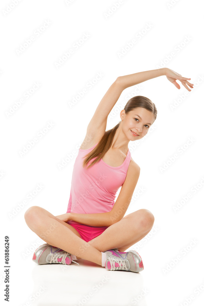 Young sporty woman doing exercises over white Young sporty woman doing exercises over white