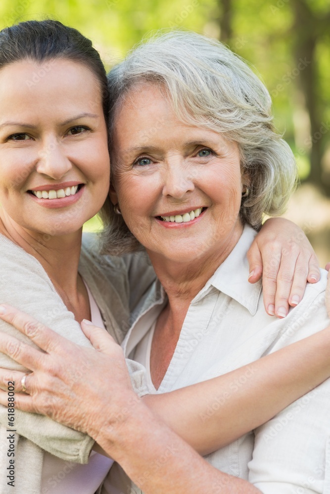 Smiling mature woman with adult daughter Smiling mature woman with adult daughter