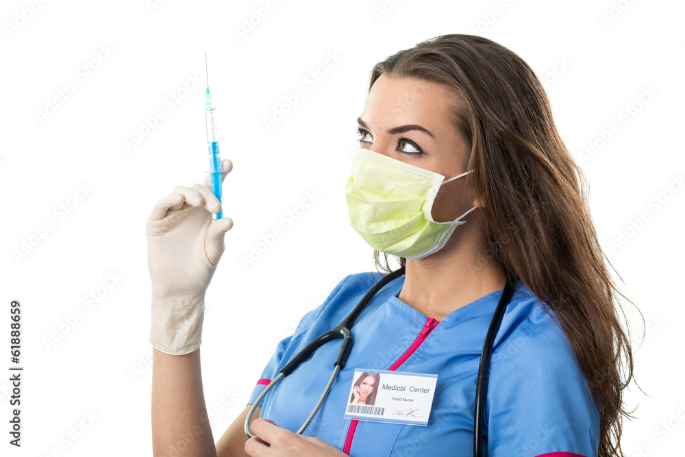Young pretty nurse in mask mouth ..with injection, detail photo Young pretty nurse in mask mouth ..with injection, detail photo