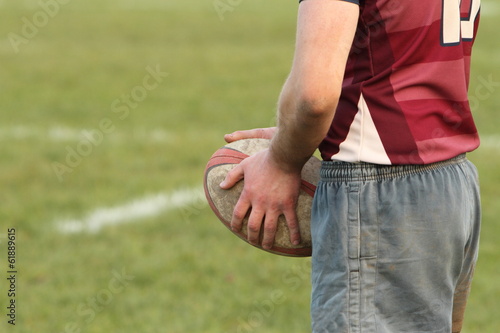 Rugby player holding a rugby ball photo