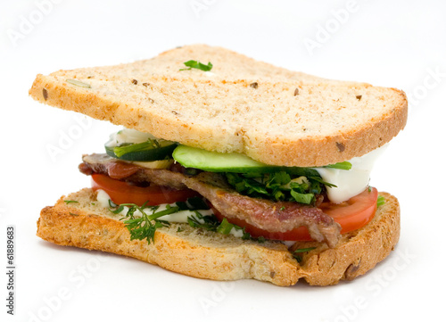 sandwich with pork cutlet, cheese, tomato, greenery, cucumber