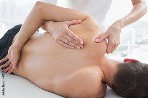 Fototapeta Naklejka Na Ścianę i Meble -  Physiotherapist massaging man