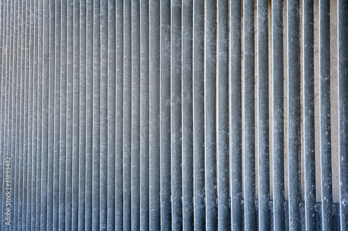 Striped metal vertical rough grated wall