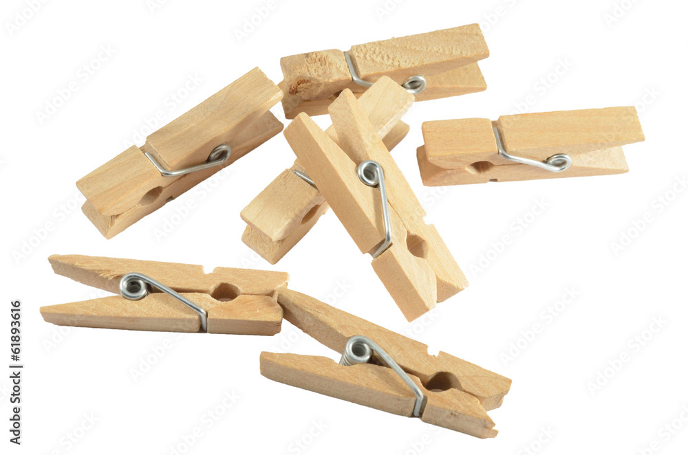 Wooden clothespins on the white background Wooden clothespins on the white background