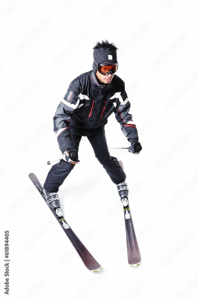 One male skier skiing with full equipment on a white background One male skier skiing with full equipment on a white background