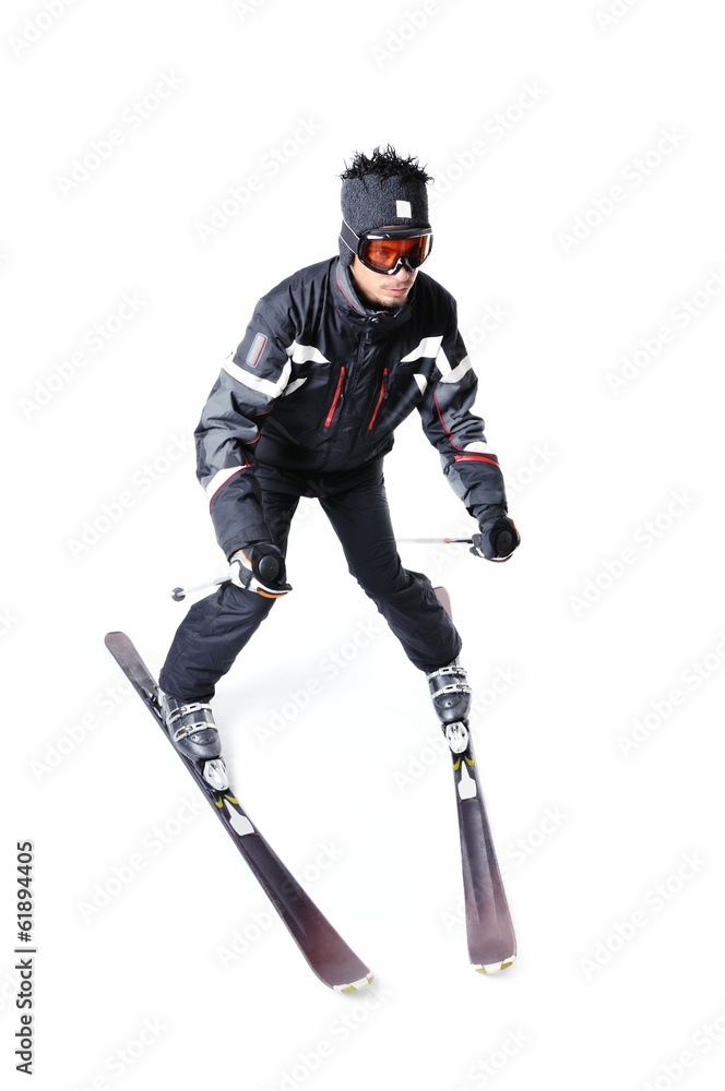 One male skier skiing with full equipment on a white background