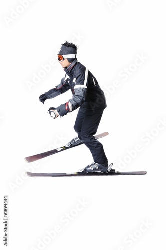 One male skier skiing without sticks on a white background © cirkoglu