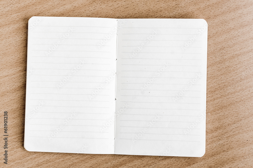 Notebook on wood table Notebook on wood table