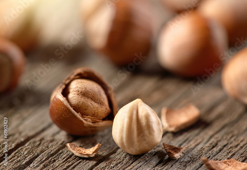 Hazelnuts, filbert on old wooden background