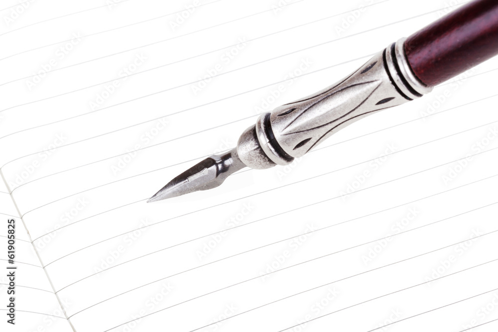 Writing in a text book with luxury retro ink pen isolated Writing in a text book with luxury retro ink pen isolated