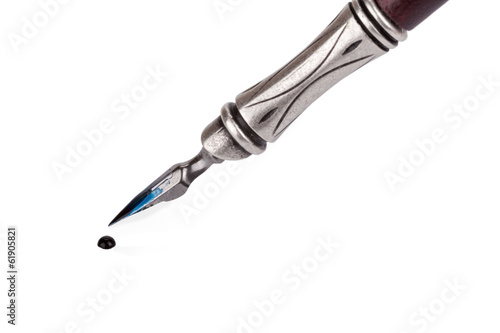 Old fashioned ink pen with drop of ink isolated on white backgro