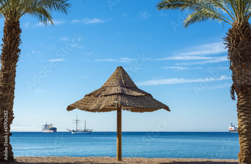 Fototapeta Naklejka Na Ścianę i Meble -  Sunshade on the golden beach of the Red Sea