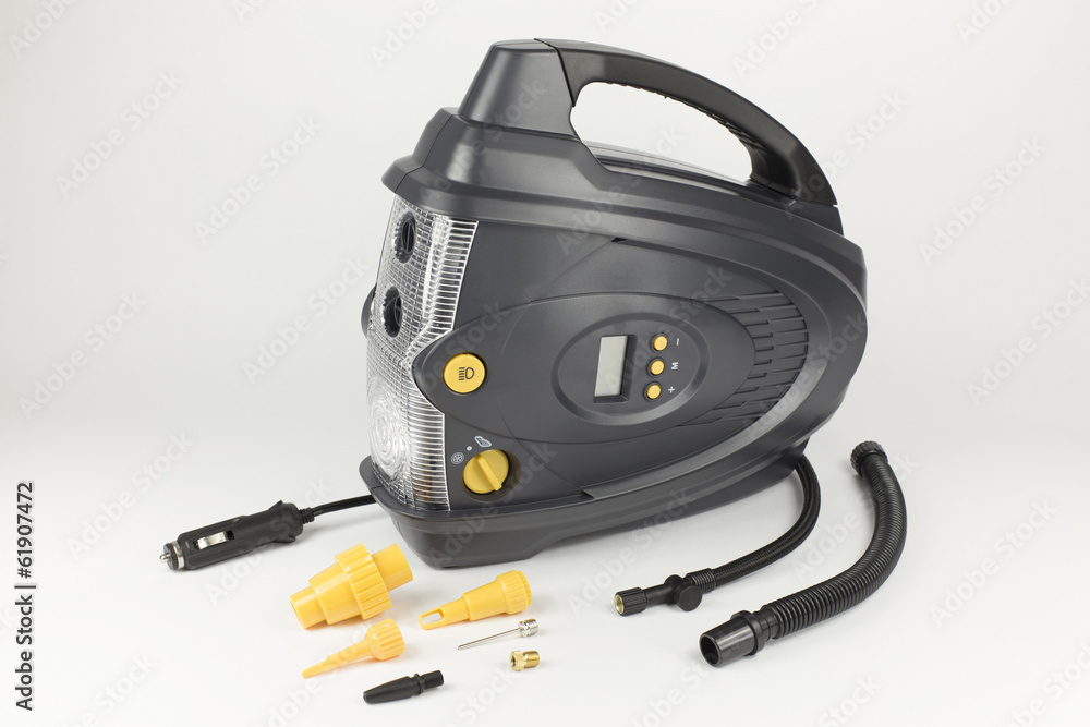 Digital car compressor with details on the light background Digital car compressor with details on the light background