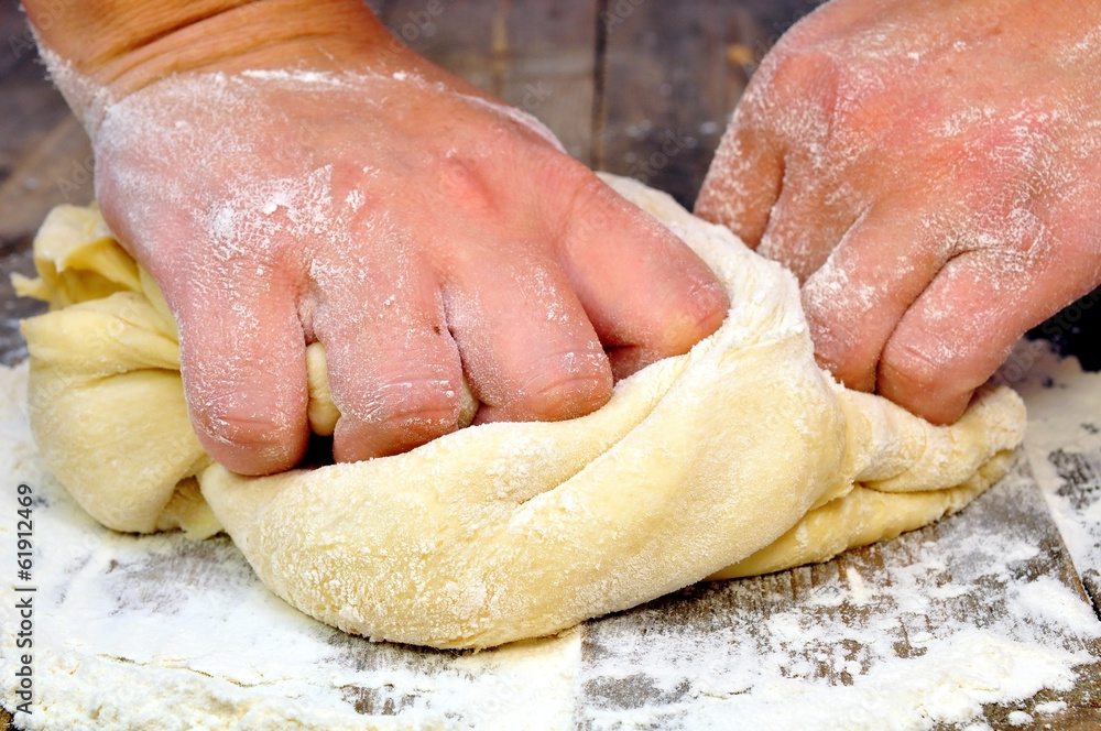 female hand kneads dough