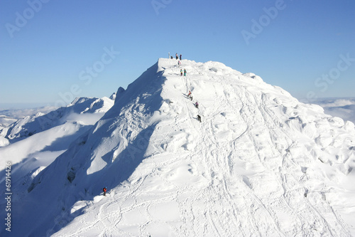 People climbing Chopok Peak, 2024 m photo