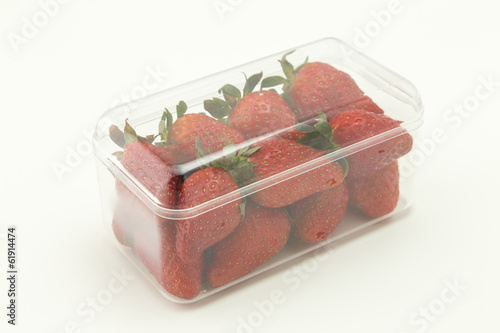 Strawberries in transparent plastic recipient ready to be sold