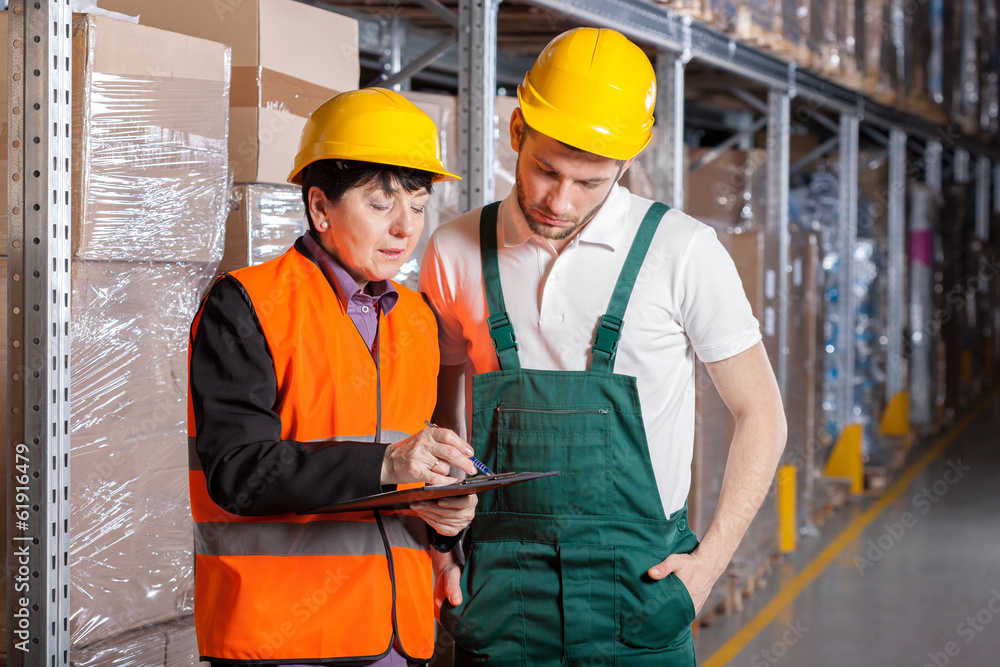 Manager and worker in warehouse Manager and worker in warehouse