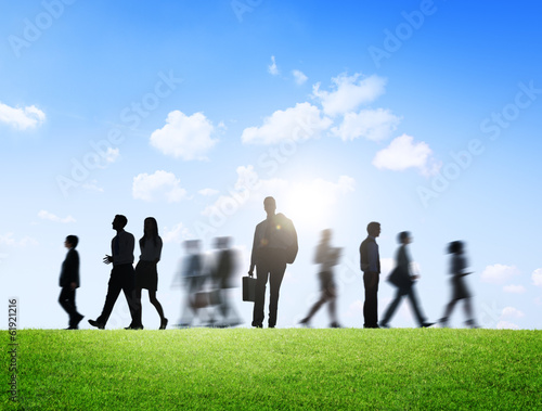 Silhouette of Business People in Motion on a Brand New Day