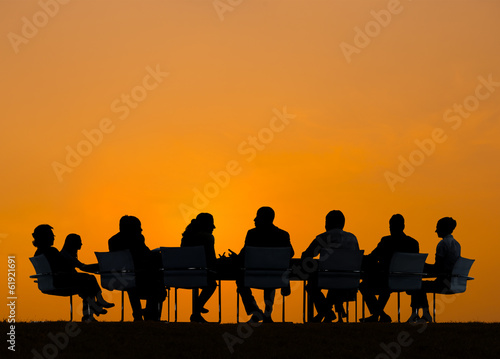 Obraz na plátne Group of Business People Meeting at Sunset
