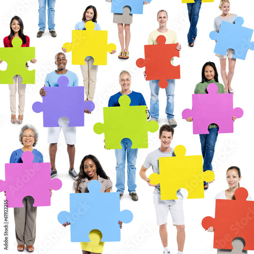 Diverse World People Holding Jigsaw Pieces