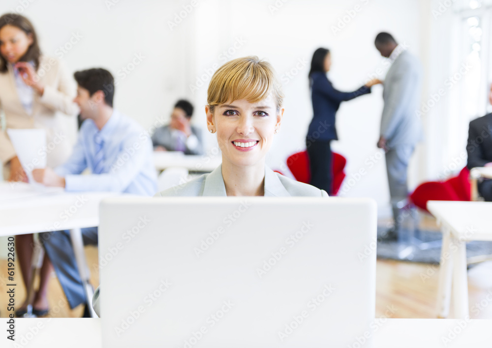 Business Woman with Colleagues in the Office